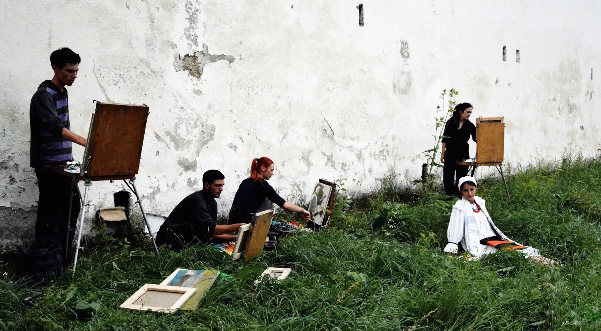 Archival photograph, 2016, Sibiu, Romania; participants working with easels outdoors during an educational residential plein-air art programme.