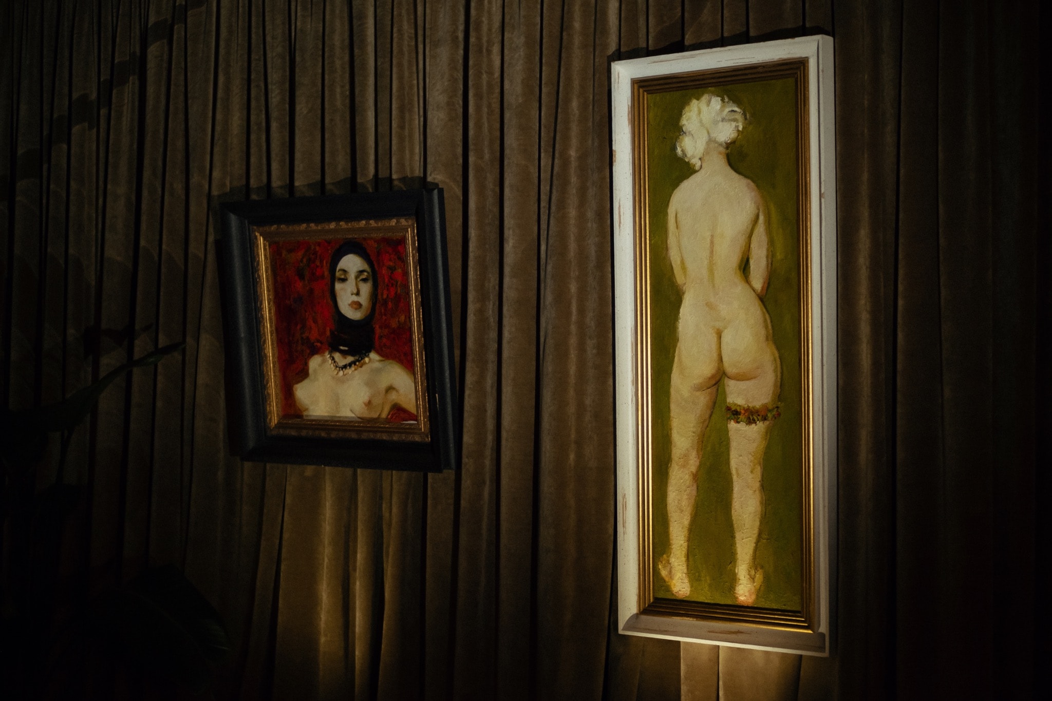 Installation view of Nudes, Bucharest, 2022, with two paintings by Victor Teslaru.